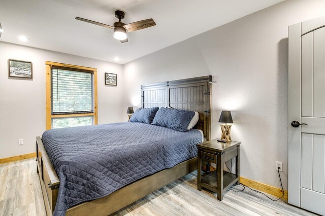 bedroom featuring ceiling fan and light wood-type flooring