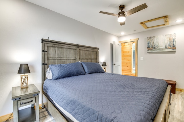 bedroom featuring ceiling fan and hardwood / wood-style floors