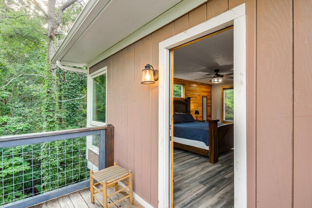 wooden deck featuring ceiling fan