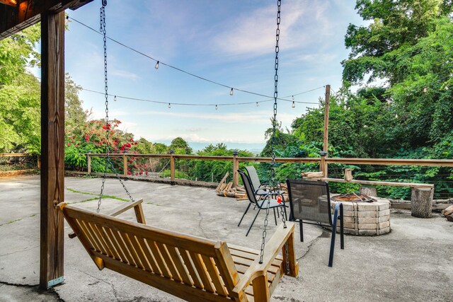 view of patio / terrace with a fire pit