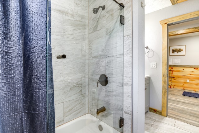 bathroom featuring shower / bathtub combination with curtain and vanity