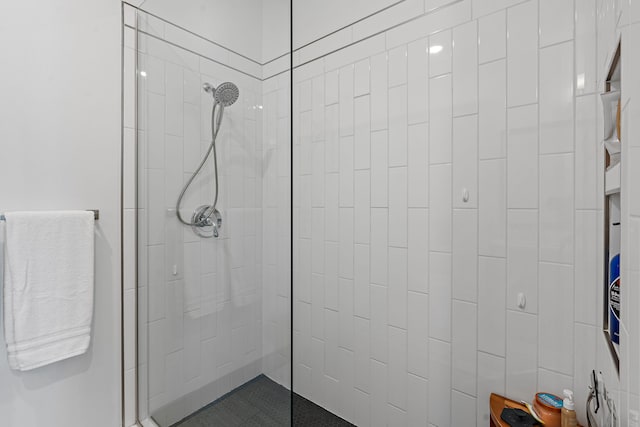 bathroom with tiled shower