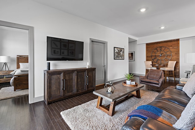 living room with dark hardwood / wood-style flooring