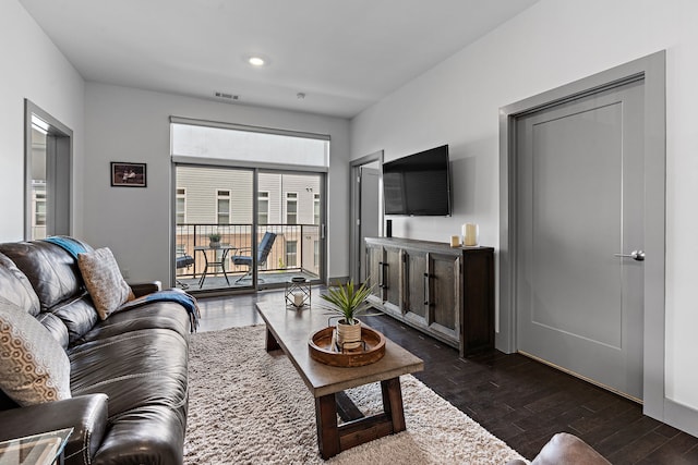 living room with dark hardwood / wood-style floors