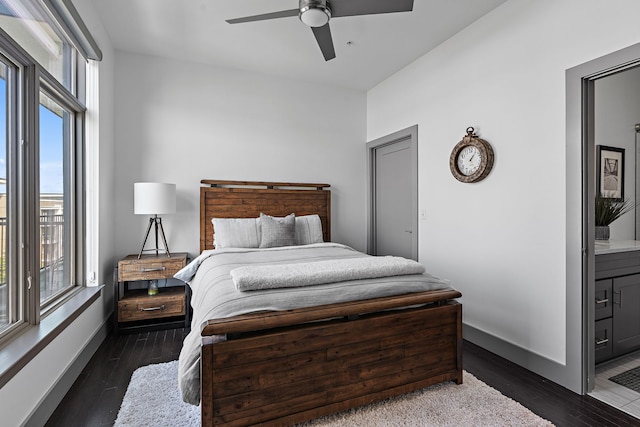 bedroom featuring connected bathroom, ceiling fan, and dark hardwood / wood-style floors