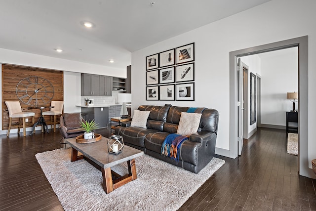 living room with dark hardwood / wood-style flooring