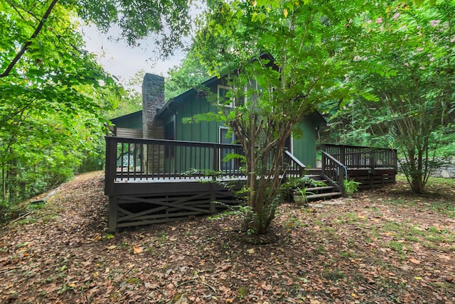 back of property featuring a wooden deck