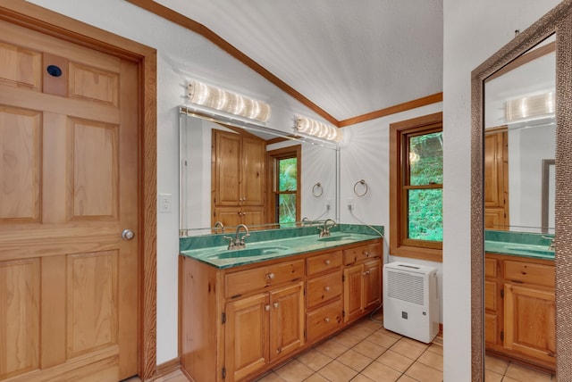 bathroom featuring ornamental molding, vanity, and tile patterned floors