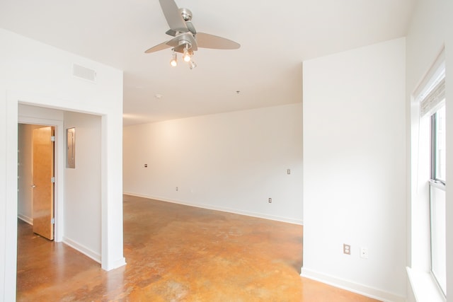 unfurnished room with ceiling fan