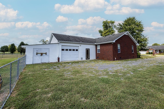 exterior space featuring a garage, driveway, fence, crawl space, and brick siding