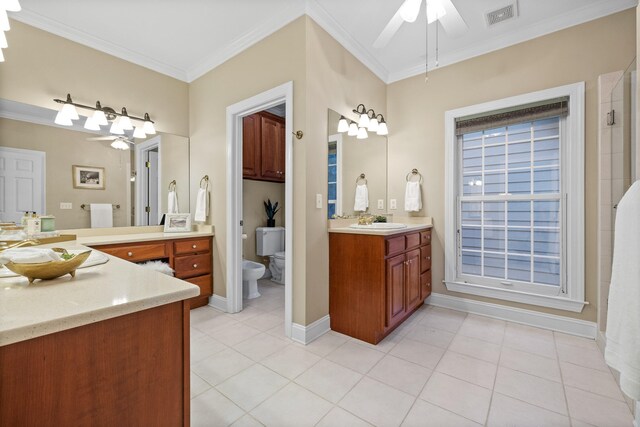 bathroom with toilet, ornamental molding, vanity, and a bidet