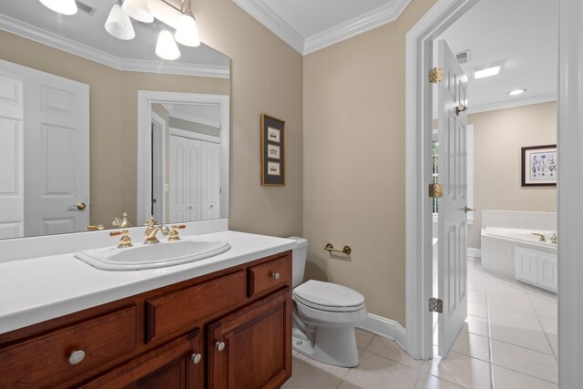 bathroom featuring toilet, a bathing tub, vanity, ornamental molding, and tile patterned flooring