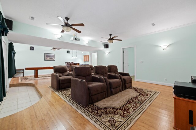 home theater room featuring light hardwood / wood-style flooring