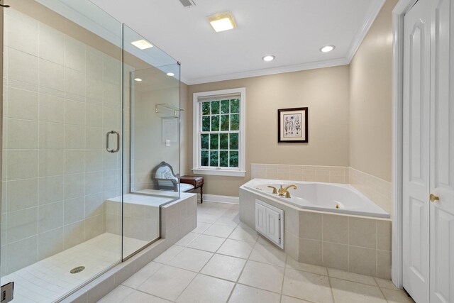 bathroom featuring ornamental molding, plus walk in shower, and tile patterned flooring