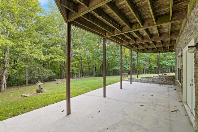 view of patio featuring a forest view