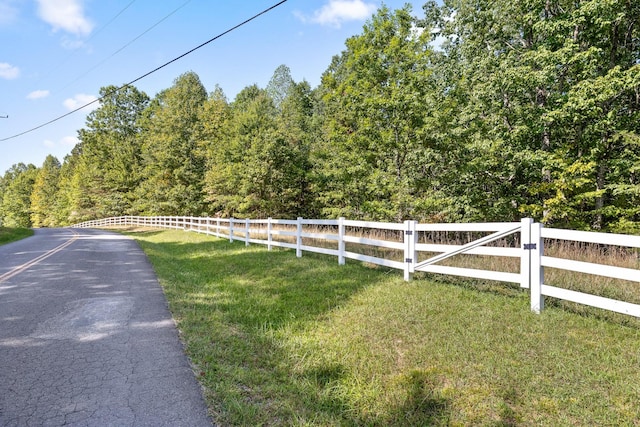 view of road with a forest view