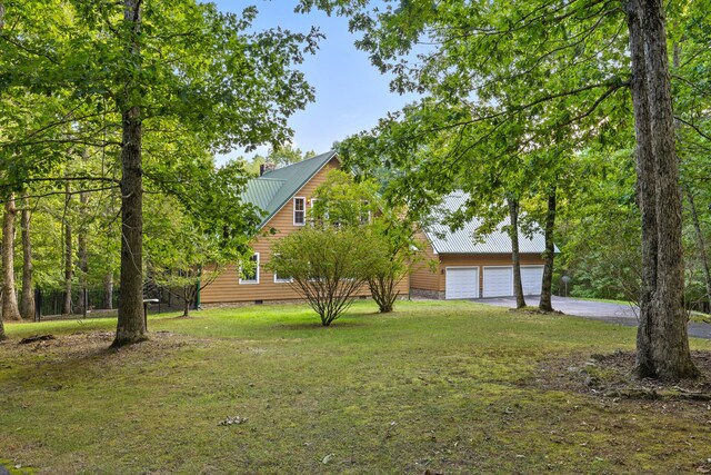 view of yard with a garage