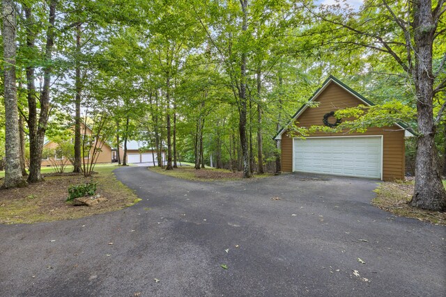 view of front of home with an outdoor structure and a garage