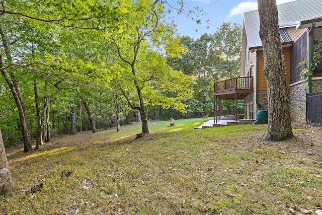 view of yard featuring a wooden deck