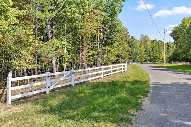 view of street featuring a wooded view