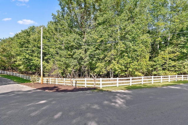view of street featuring a forest view