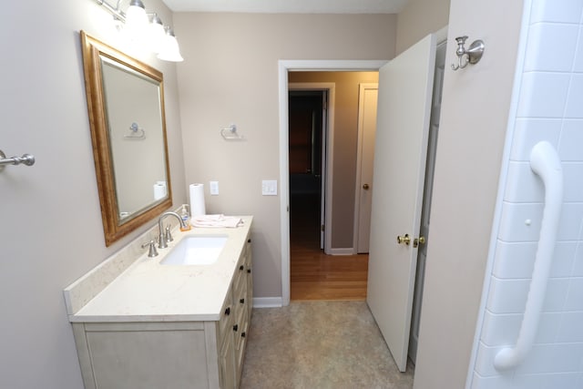 bathroom with hardwood / wood-style flooring and vanity