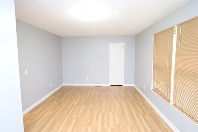 empty room with light hardwood / wood-style floors