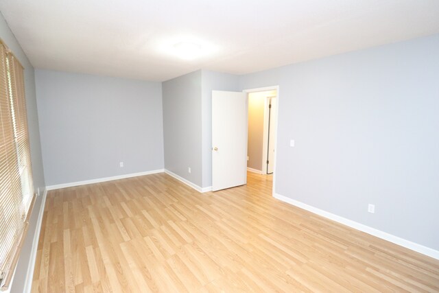 unfurnished room with light hardwood / wood-style floors