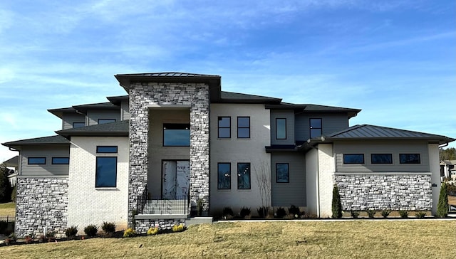 prairie-style house with a front lawn