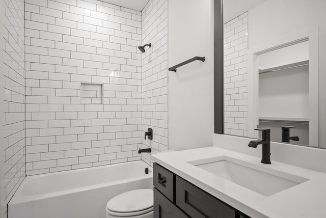 bathroom with shower / bathing tub combination, vanity, and toilet