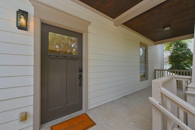 doorway to property with covered porch