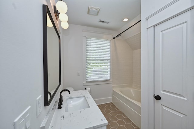 bathroom featuring tile patterned flooring, visible vents, baseboards, shower / bath combination, and vanity