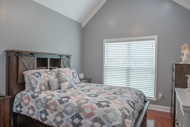 bedroom with ornamental molding, vaulted ceiling, multiple windows, and dark hardwood / wood-style floors