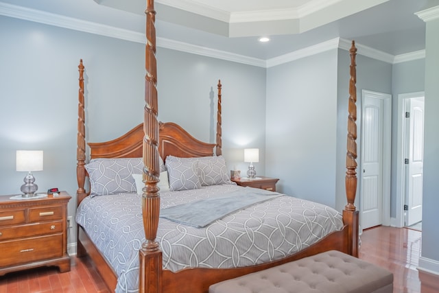 bedroom featuring light wood-type flooring and ornamental molding