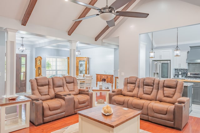 living room featuring ceiling fan with notable chandelier, light wood-type flooring, vaulted ceiling with beams, and ornate columns