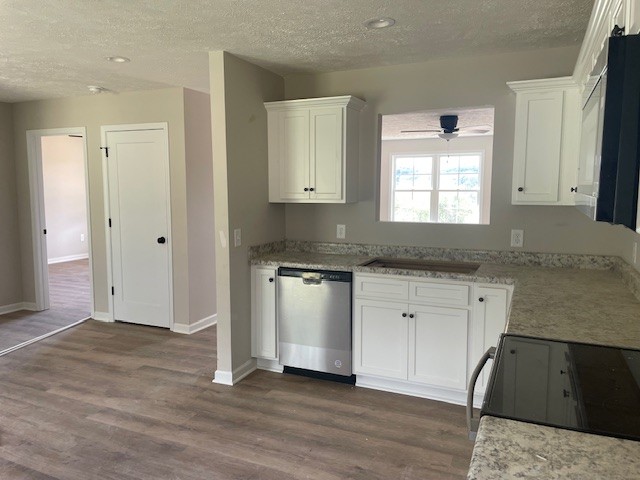 kitchen featuring white cabinetry, dark wood-type flooring, dishwasher, and black stove