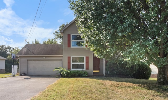 view of front of home featuring a front lawn and a garage