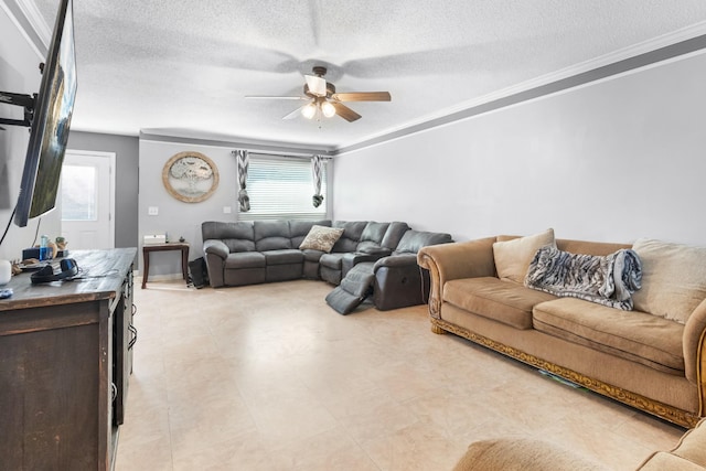 living room featuring a textured ceiling, a ceiling fan, and ornamental molding