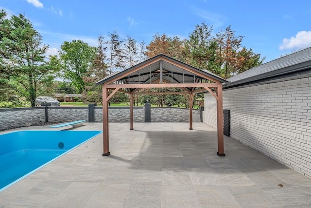 view of pool featuring a patio and a gazebo