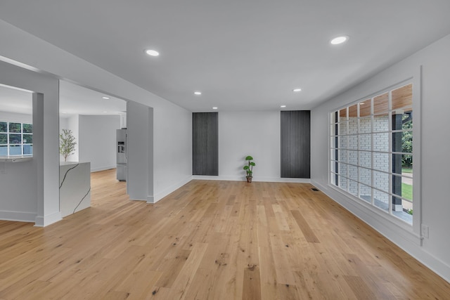 unfurnished room featuring light hardwood / wood-style flooring