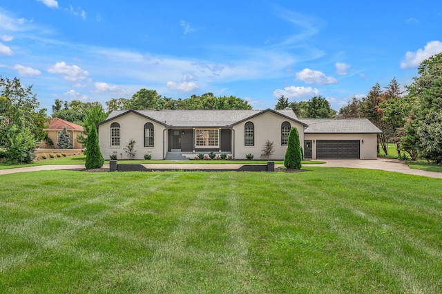 single story home featuring a garage and a front lawn