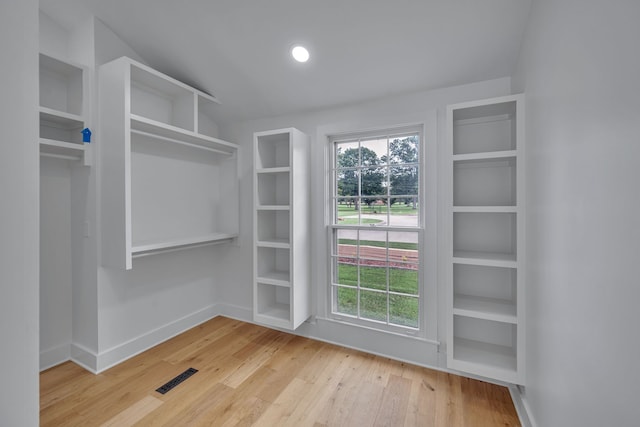 walk in closet featuring light hardwood / wood-style floors