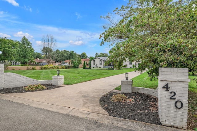 surrounding community featuring a yard