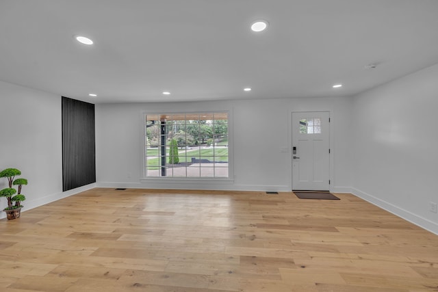 entrance foyer featuring light hardwood / wood-style flooring and a wealth of natural light