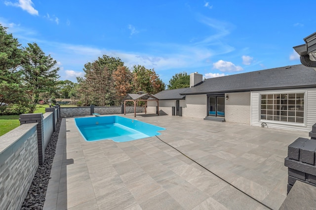 view of pool with a patio and a gazebo