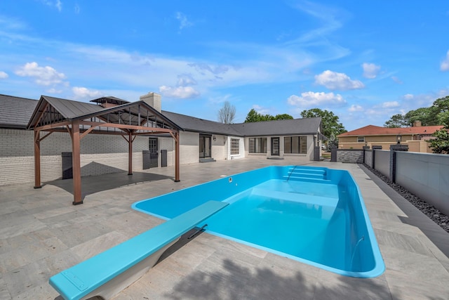 view of swimming pool with a gazebo