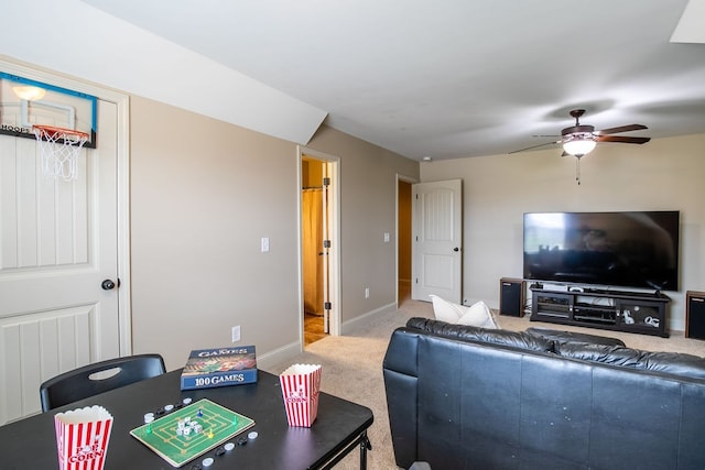 carpeted living room featuring ceiling fan