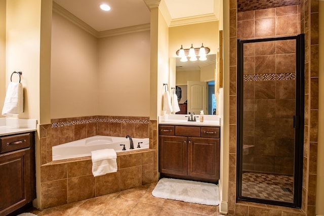 bathroom featuring crown molding, vanity, independent shower and bath, and tile patterned floors