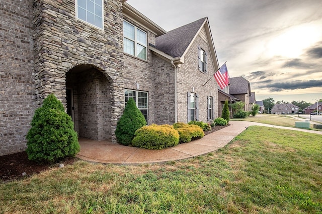 view of home's exterior featuring a yard