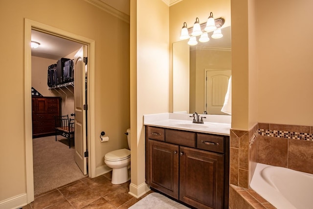 bathroom with vanity, crown molding, toilet, tile patterned floors, and tiled tub